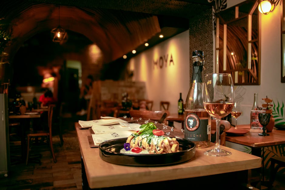 Intimate Bari restaurant table with plated dish and a glass of wine