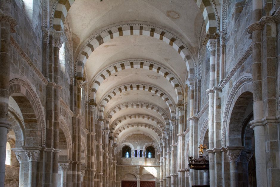 Romanesque nave arches and columns inside Bari's San Nicola Basilica