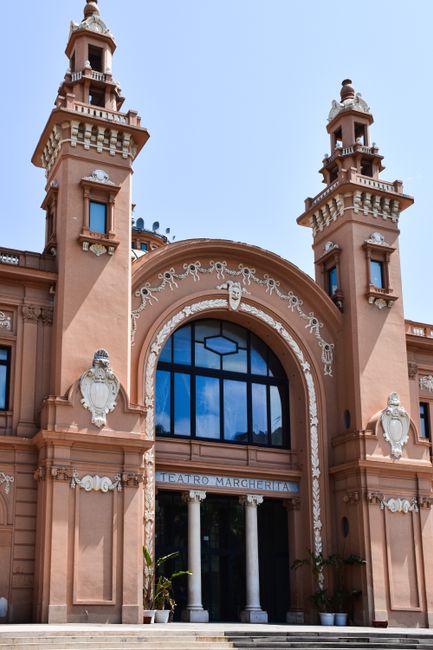 Facade of Bari's Teatro Margherita with arched entrance and towers