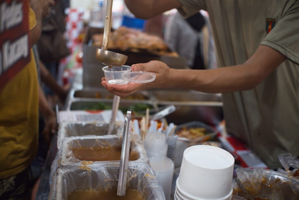 Street vendor scooping granita