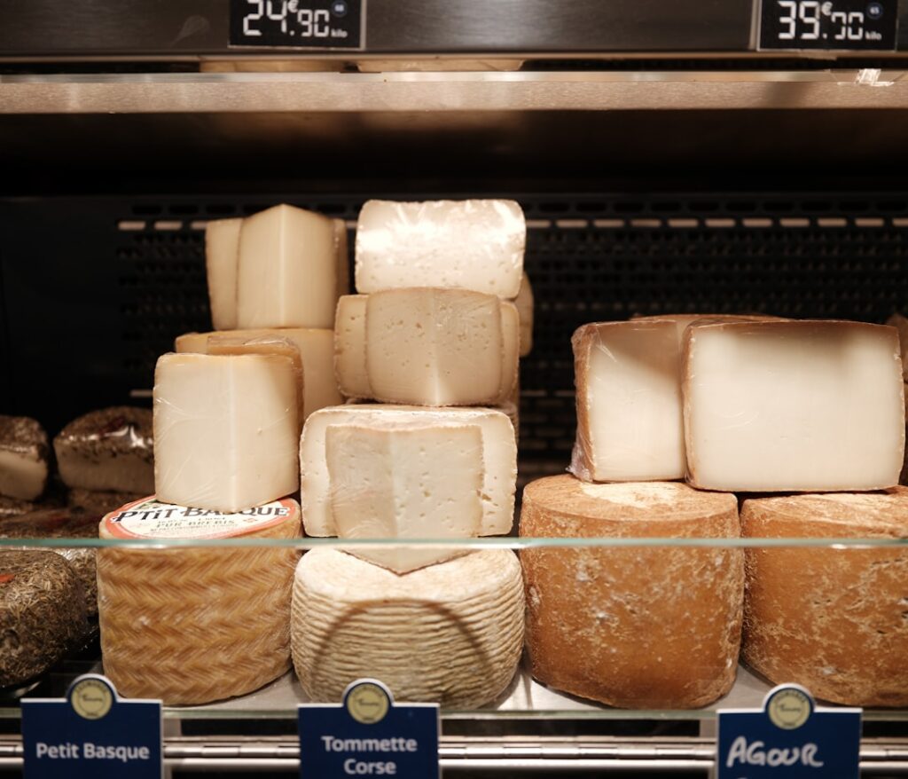 Assorted Italian cheeses displayed on a market table