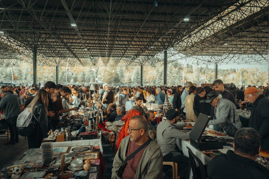 Crowded covered market hall in Piedmont with vendors and browsing shoppers