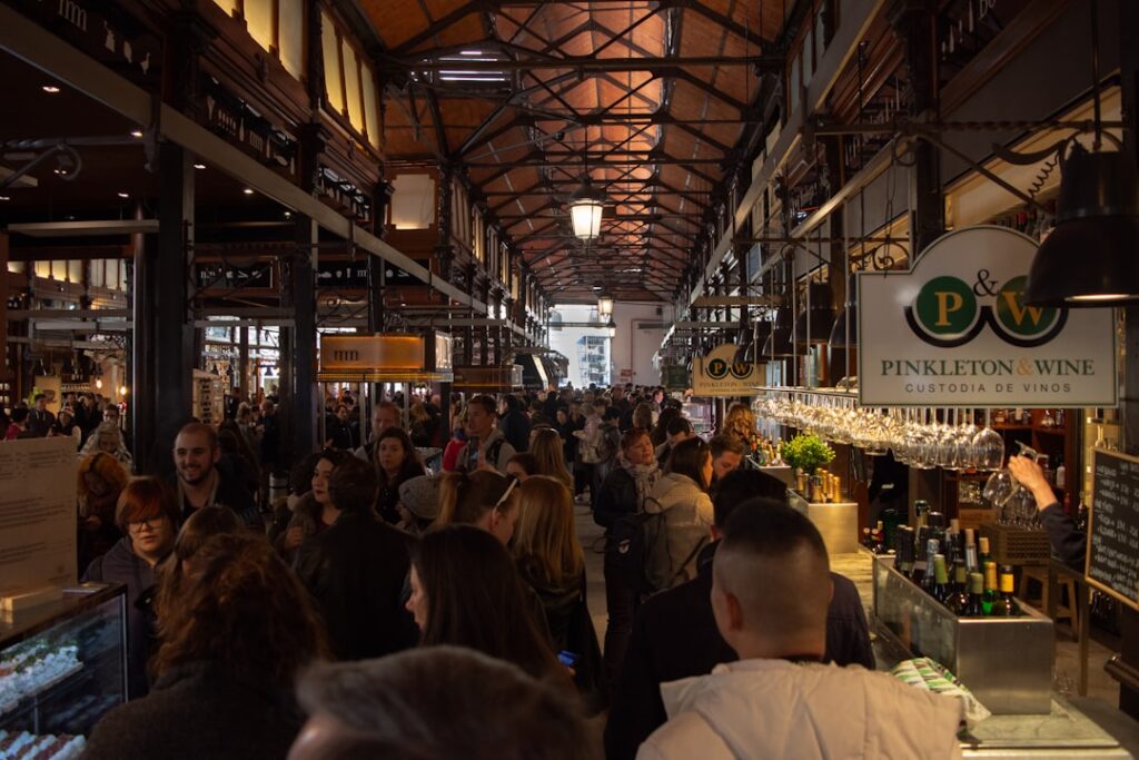 Traveler tasting local wine at a market