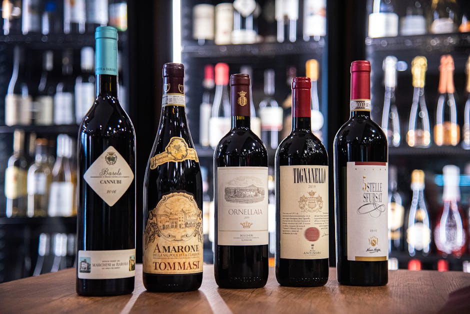 Row of Italian wine bottles displayed at a Piedmont enoteca