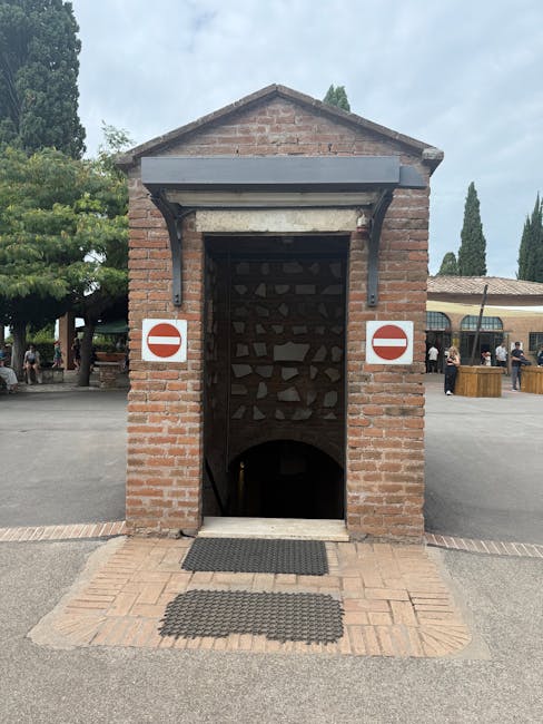 Brick cellar entrance with no-entry signs leading down at Piedmont winery