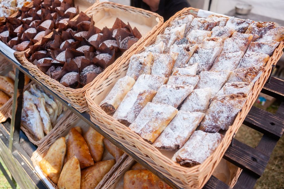 Wicker basket filled with powdered pastry rolls at a Piedmont market