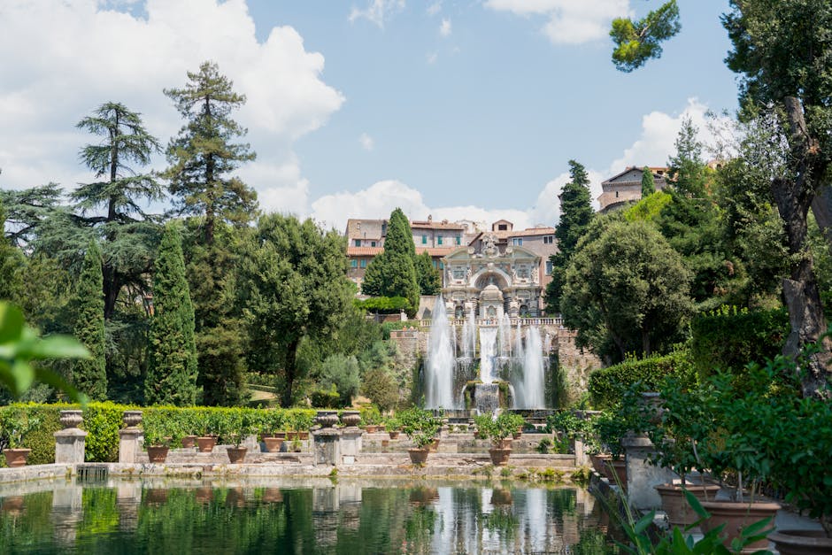 Baroque fountain cascading into reflective pond at Villa d'Este, Latium