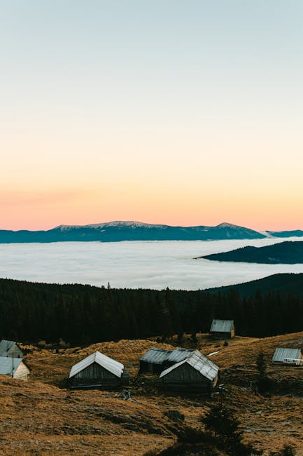 Small wooden cabins on a Latium hilltop above a sea of clouds