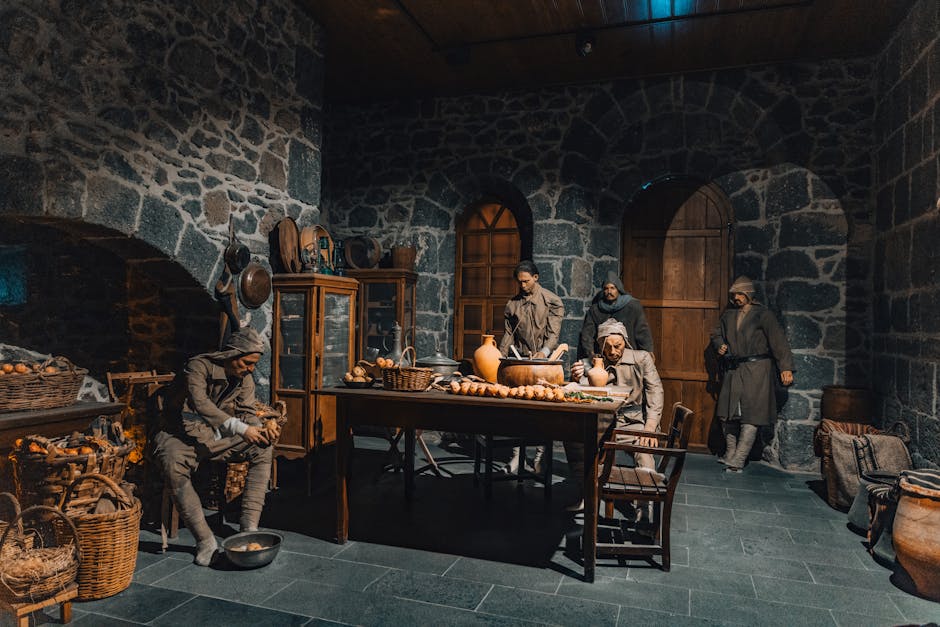 Museumzaal toont historische poppen rond tafel in een stenen kamer van Latium.