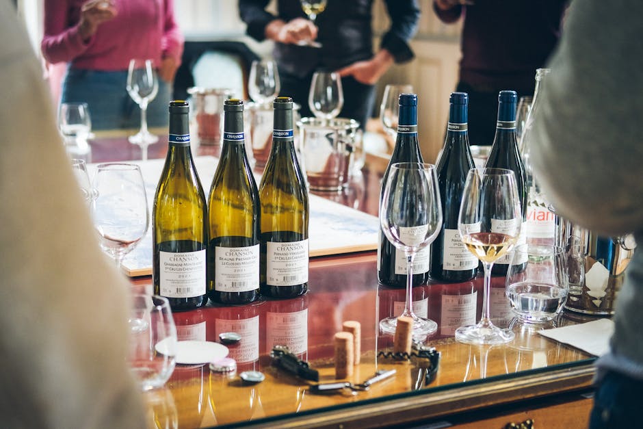 Close-up of wine bottles and corks on polished table during Latium tasting