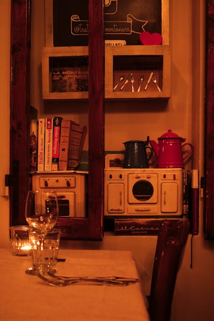 Coin chaleureux avec mini cuisinière, livres et tasses, trattoria du Latium.