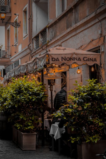 Da Nonna Gina awning and outdoor seating on a Roman alleyway, Latium