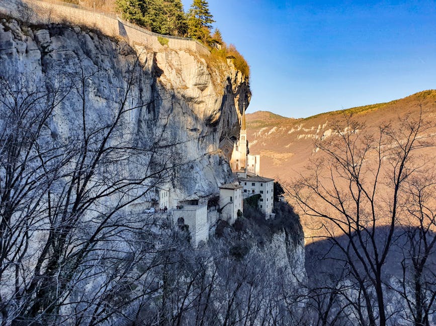 Ancient monastery clinging to Subiaco cliff face in Latium mountains.