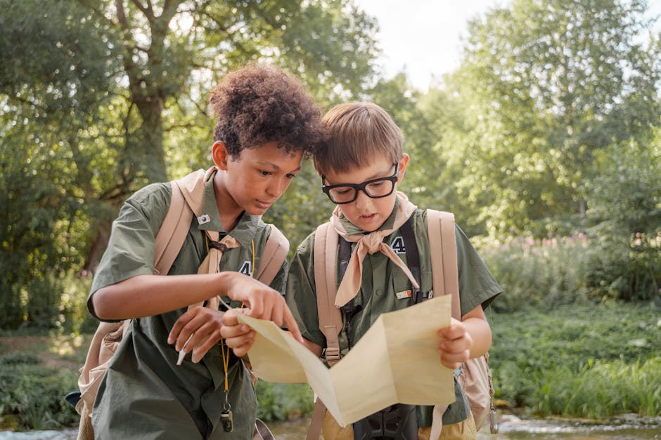 Children solving a map together outdoors