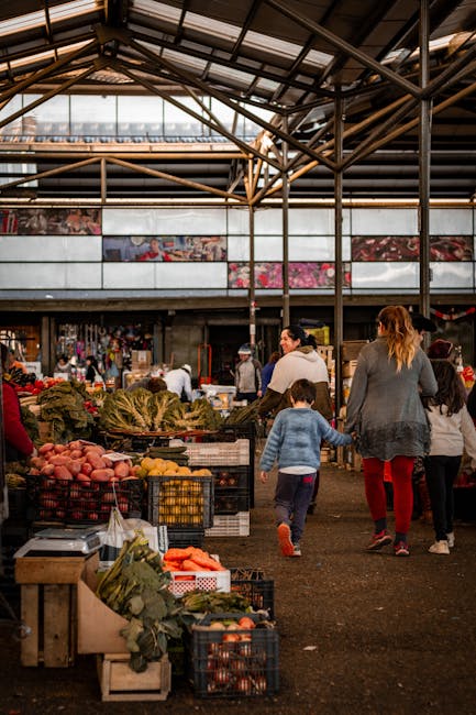 Family shopping at a local market with fresh produce in Perugia