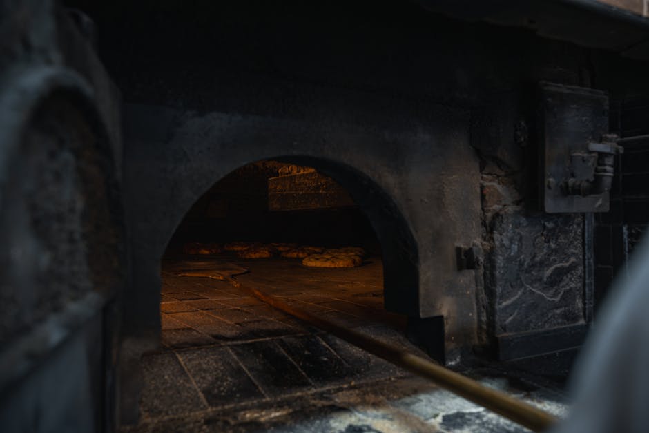 Interieur van een bakkerij met houtoven in Via Pinturicchio