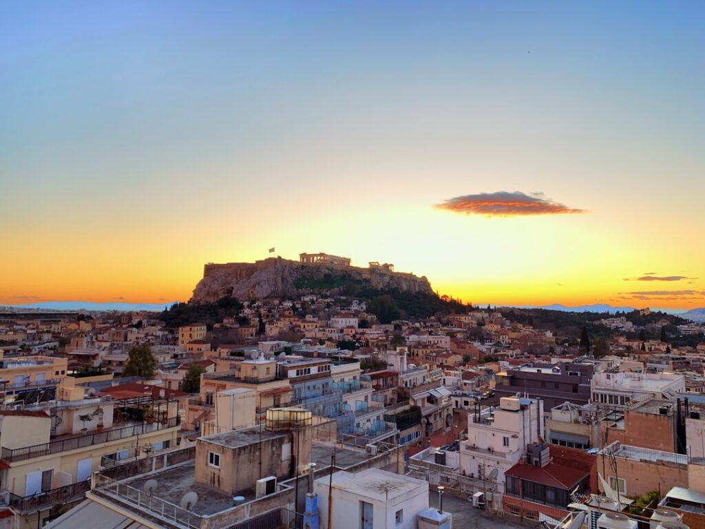 Rooftop view of the Acropolis at sunset from Zillers Hotel