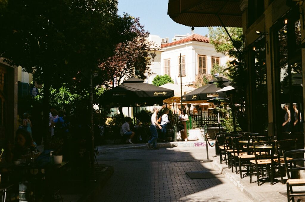Outdoor street café in Athens with afternoon crowd