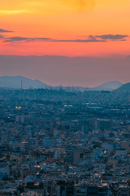 Greek rooftop sunset with city lights