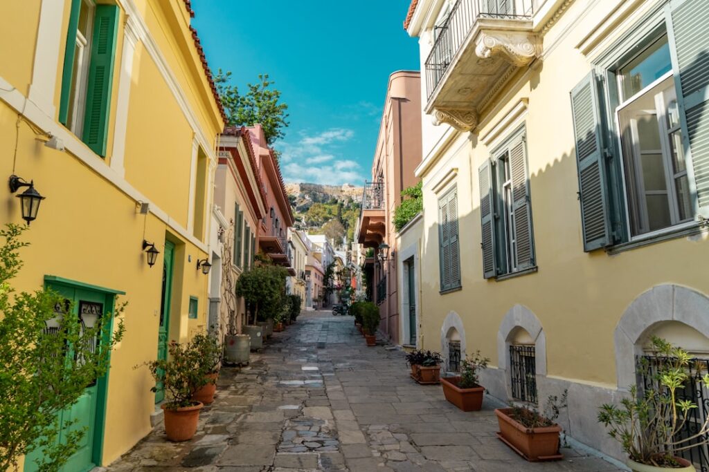 Narrow Plaka street at evening with tavern lights