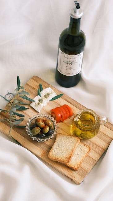 Degustacja oliwy z oliwek na pokładzie — butelki i próbki na drewnianej tacy