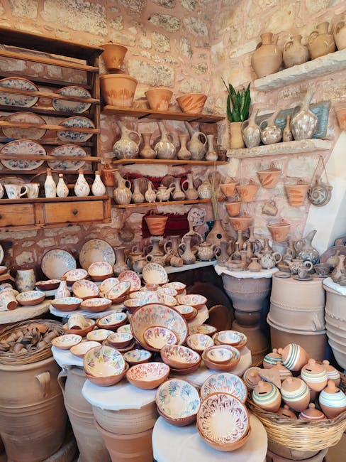 Colorful bowls and plates displayed in a ceramic gallery at Mandraki Harbor