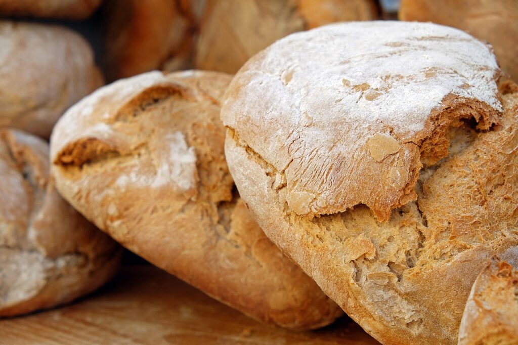 Fresh rustic sourdough loaves dusted with flour at Rhodes bakery
