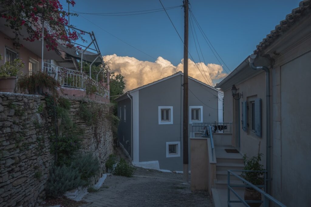 Narrow evening-lit street in Corfu Old Town
