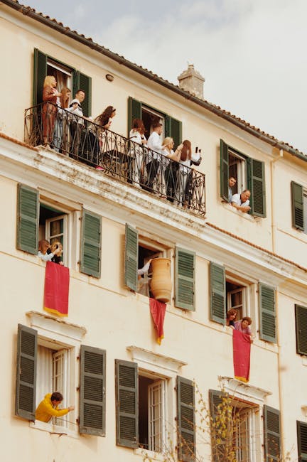 Crowd watching midnight pot throwing from balconies in Corfu