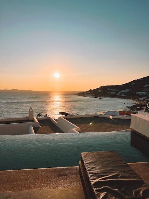 coucher de soleil sur piscine à débordement avec chaise longue, Mykonos