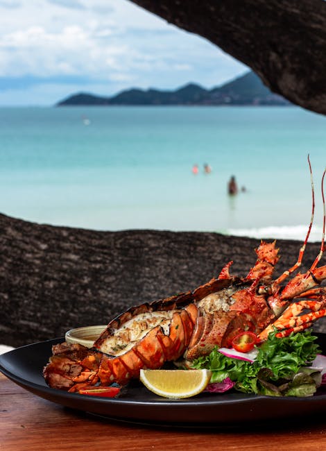 Homard grillé sur assiette avec citron, vue mer à Mykonos