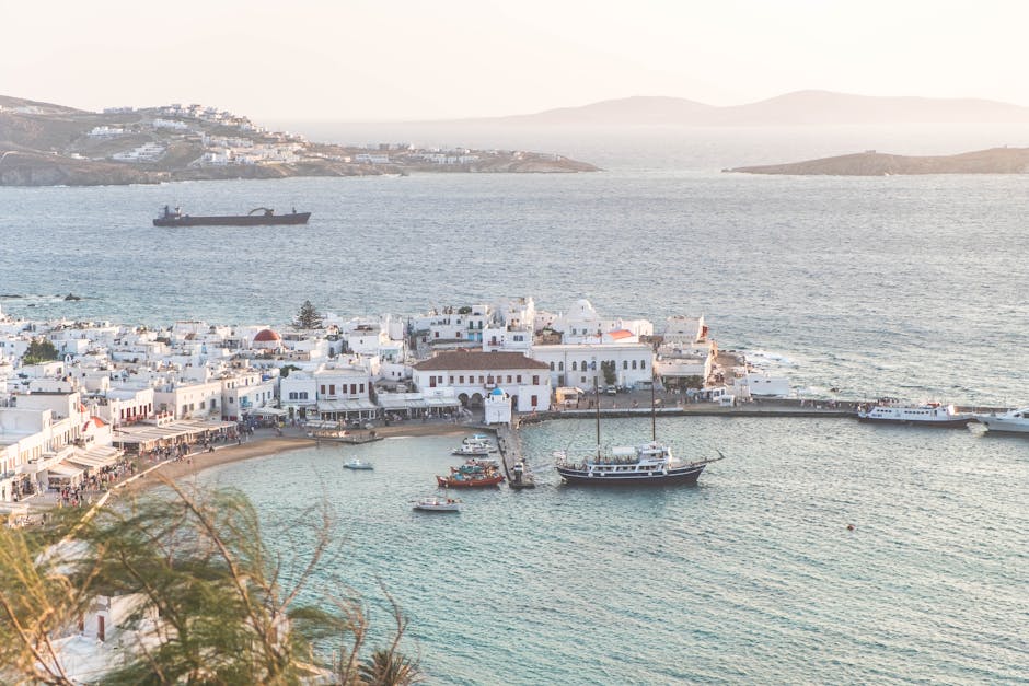 arrival at Mykonos port with boats and town in background