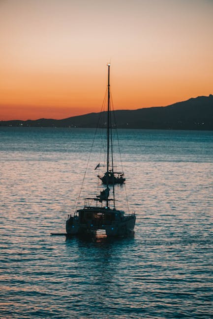yacht at sunset off the coast of Mykonos