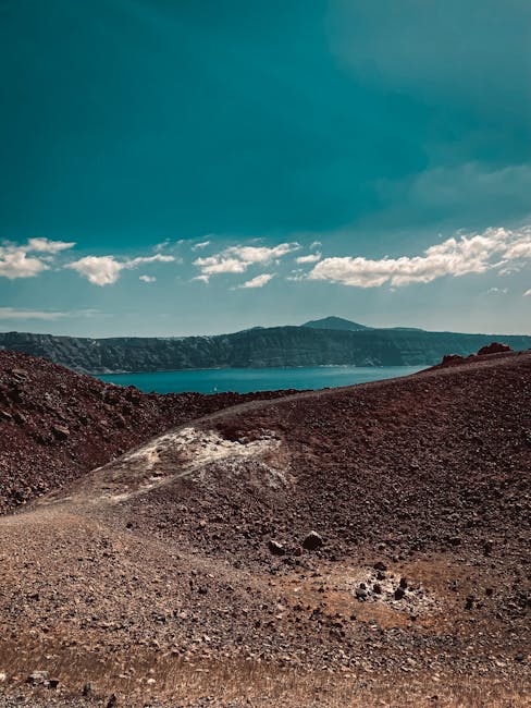 Volcanic caldera rim and turquoise water on Santorini island