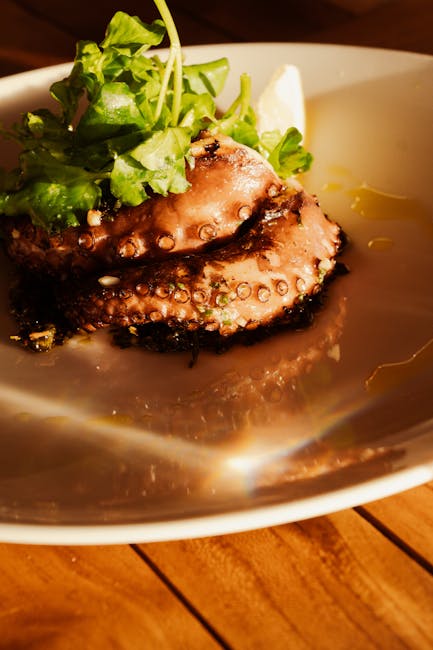 Tentacules de poulpe grillé servies avec roquette et citron à Mykonos