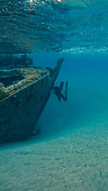 Duiker verkent scheepswrak onder water bij Mykonos