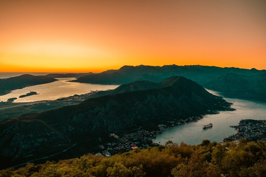 Hikers on Kotor city walls at sunrise