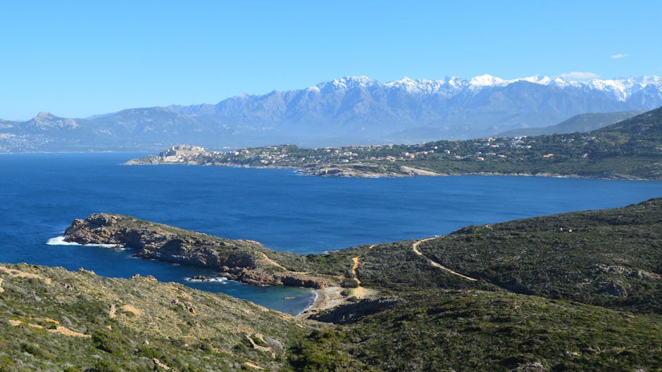 Coastal headland and distant town across the bay near Kotor