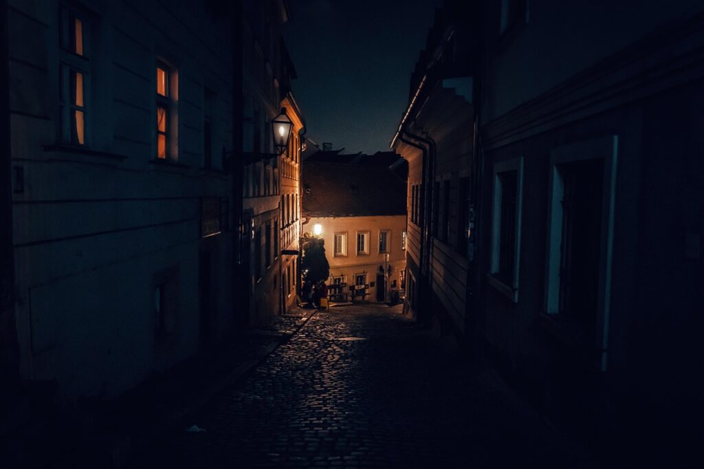 Quiet alley in Kotor old town at night with lamps