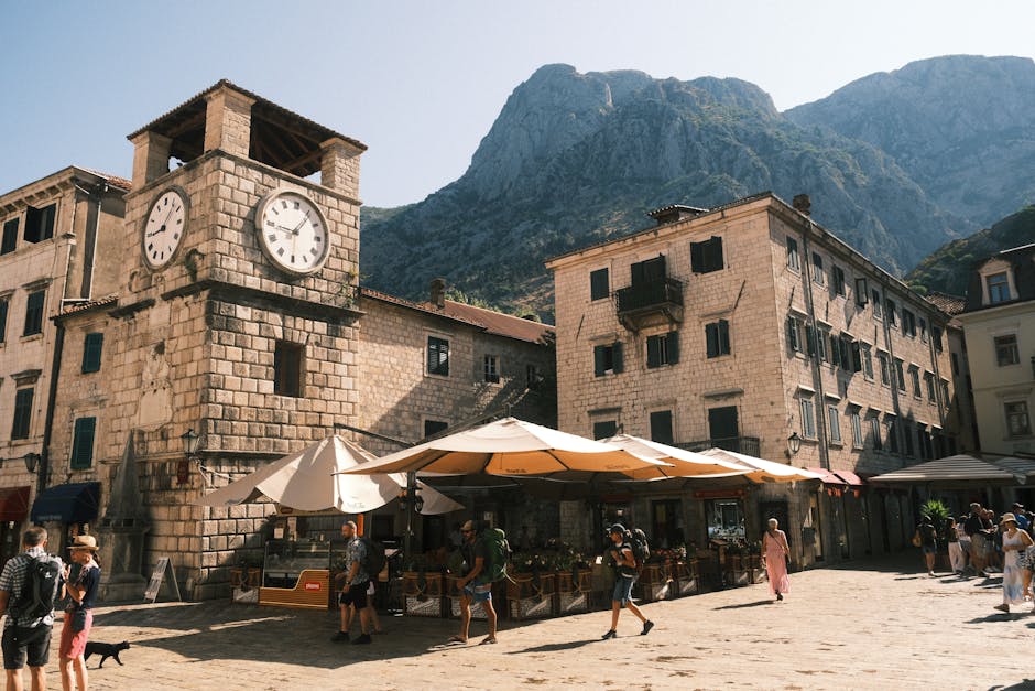 Busy day in Kotor Old Town square Trg od Oružja with tourists