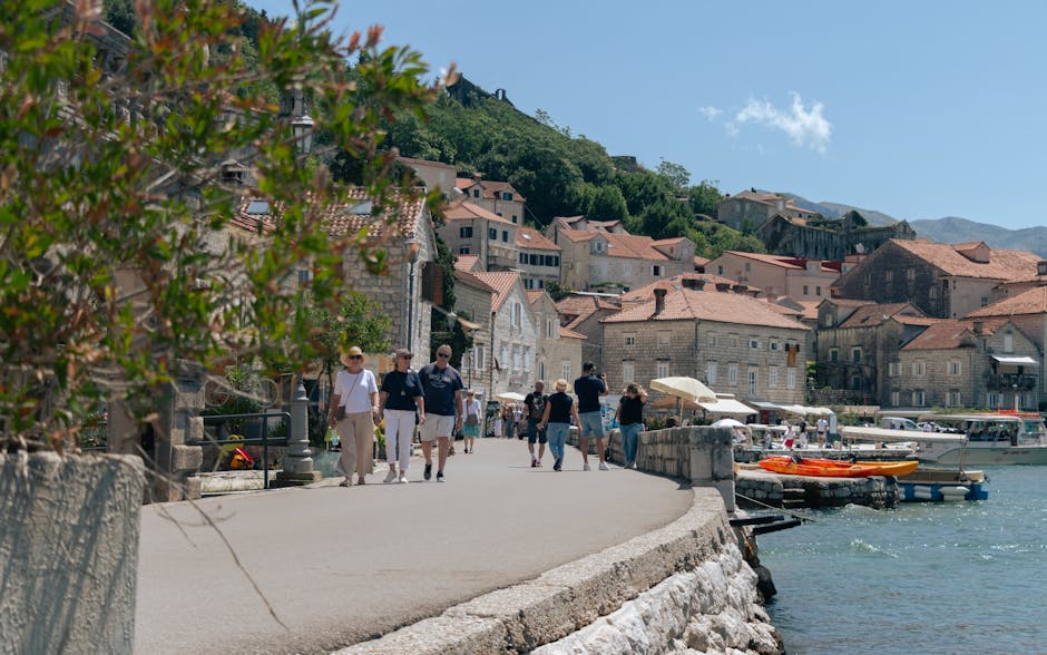 Walk from Kotor bus station to old town along the coastal promenade