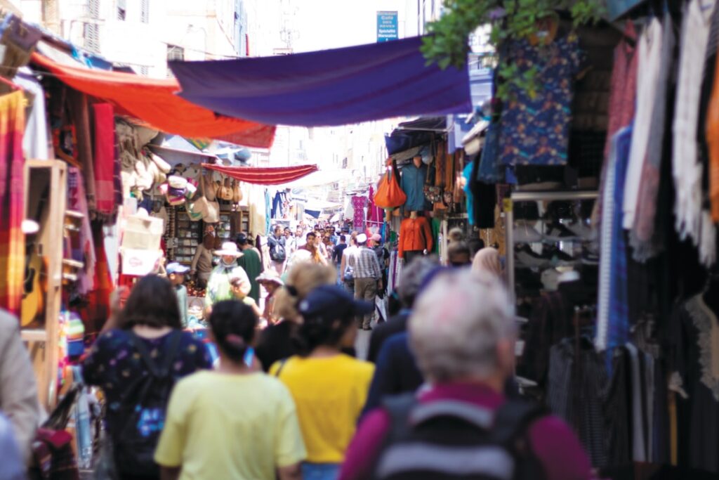 Busy market street in Tirana with locals shopping