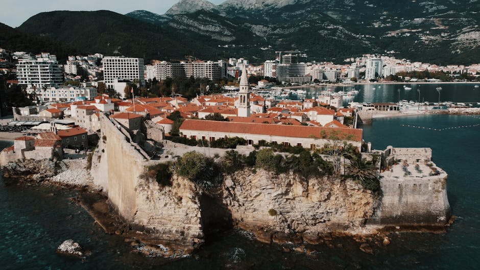Fortified Budva old town perched on rocky peninsula, Montenegro shoreline