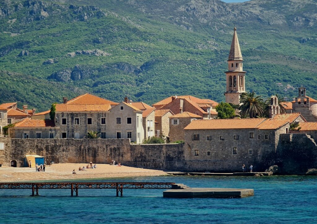 Medieval walled town in Montenegro with bell tower and stone walls