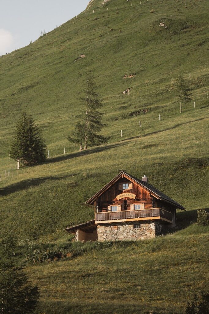 Wooden mountain lodge manor with Durmitor view over alpine meadow