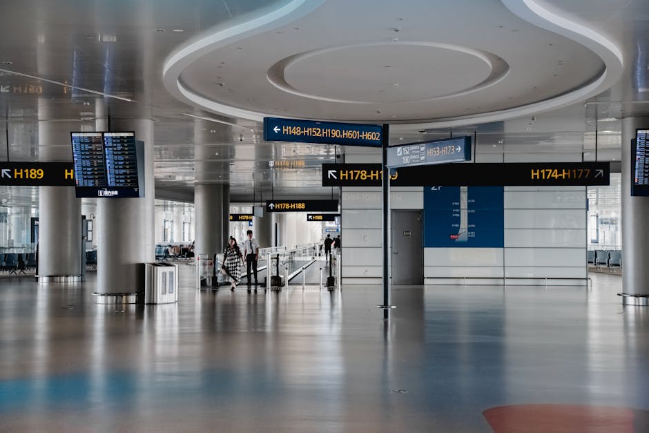 Spacious departure hall with overhead gate signs at Tivat Airport, Montenegro