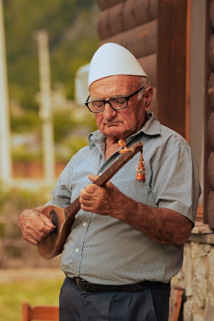Elderly Albanian musicians playing at a village festival