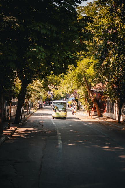 Minibus arriving at the main street of an Albanian village festival