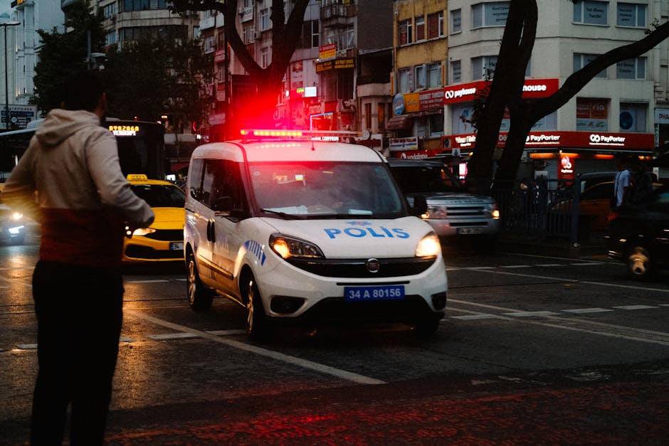 police car at night in an Albanian city street