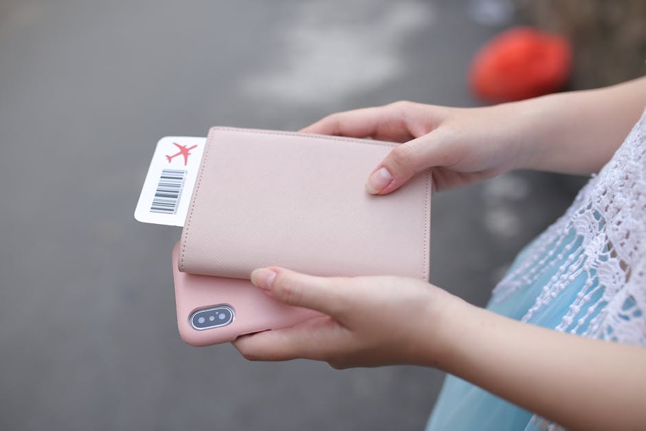Traveler hands holding passport and boarding pass in Albania